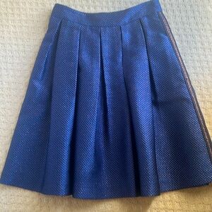 Tara Jarmon pleated holiday skirt. blue with imbedded gold threads. Size 40.